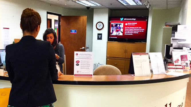 digital signage behind front desk