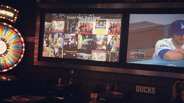 digital signage showing social media feed in bar